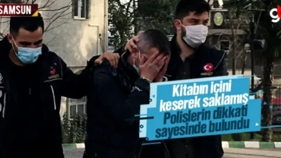 Kitabın içini keserek saklamış